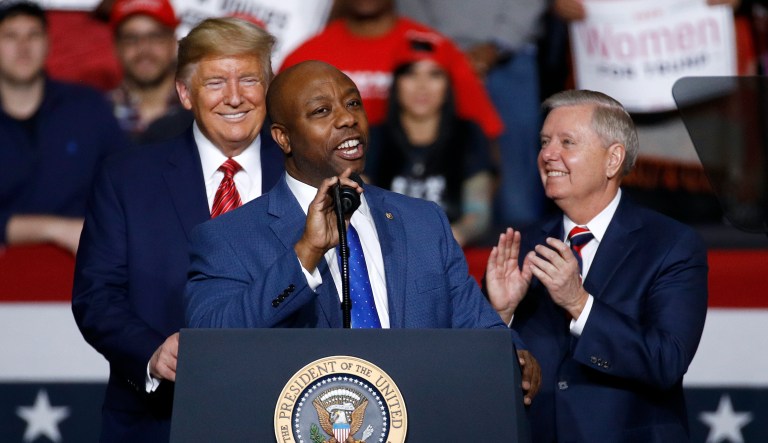 FILE - Sen. Tim Scott, R-S.C., speaks in front of President Donald Trump and Sen. Lindsey Graham, R-S.C., during a campaign rally, Friday, Feb. 28, 2020, in North Charleston, S.C.