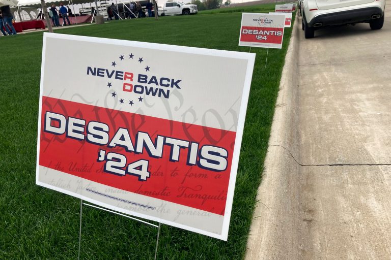 Yard signs promoting Gov. Ron DeSantis (R-FL) in 2024, financed by the super PAC promoting DeSantis for president, line the street leading up to a Republican congressional fundraiser on May 13. 2023, in Sioux Center, Iowa.