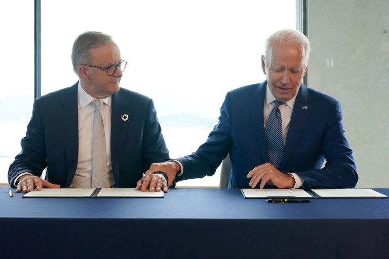 President Joe Biden, right, gestures to Australia's Prime Minister Anthony Albanese following a document signing ceremony on the sidelines of the G7 Summit in Hiroshima, Japan, Saturday, May 20, 2023.