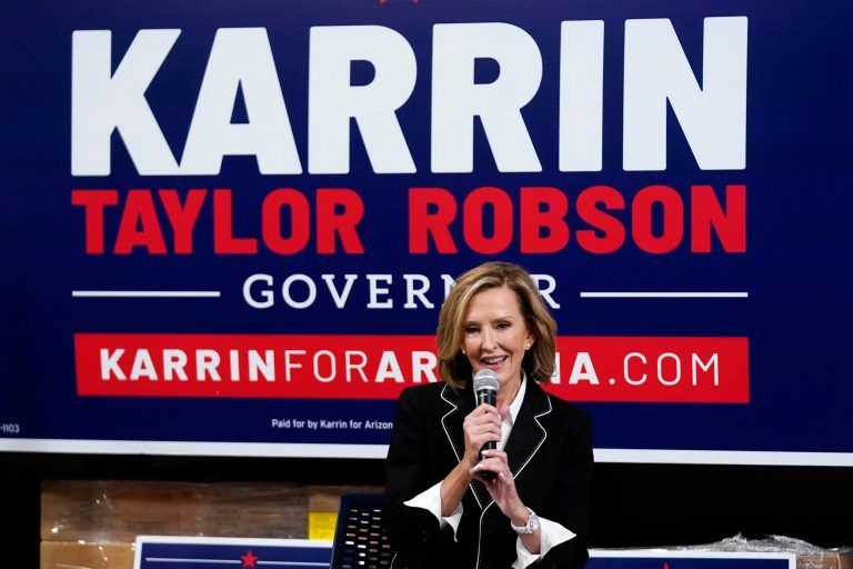 Karrin Taylor Robson, a Republican running for Arizona governor, speaks at a town hall event with former Republican New Jersey Gov. Chris Christie, July 29, 2022, in Tempe, Arizona. 