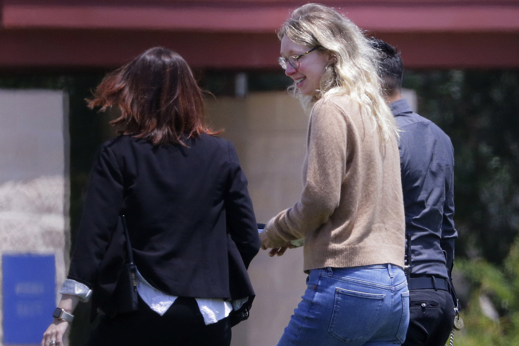 Former Theranos CEO Elizabeth Holmes reports for 11-year prison sentence