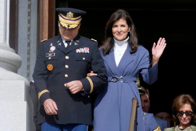 FILE - Former South Carolina Gov. Nikki Haley, right, waves as she and her husband, Michael Haley, left, are introduced at the second inaugural of Gov. Henry McMaster, Jan. 11, 2023, in Columbia, S.C. 
