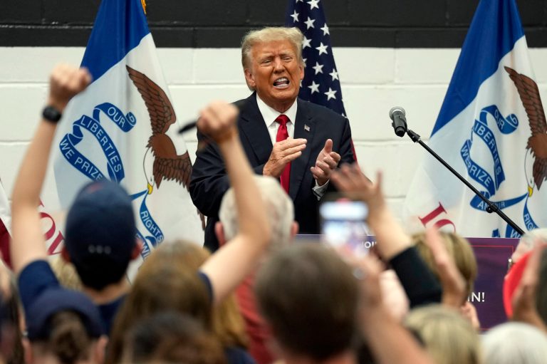 Former President Donald Trump reacts as he visits with campaign volunteers at the Grimes Community Complex Park, Thursday, June 1, 2023, in Des Moines, Iowa. 