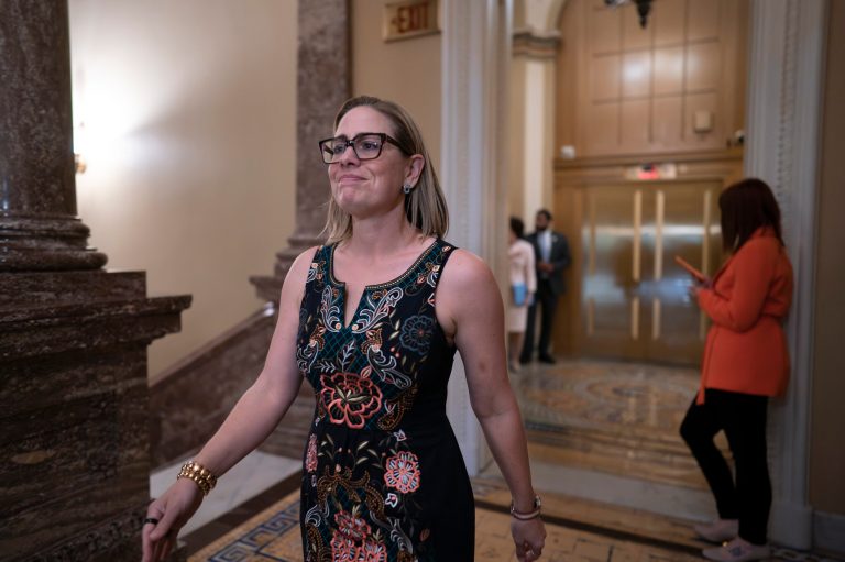 Sinema drops hint about 2024 plans with victory lap on huge spending bill
