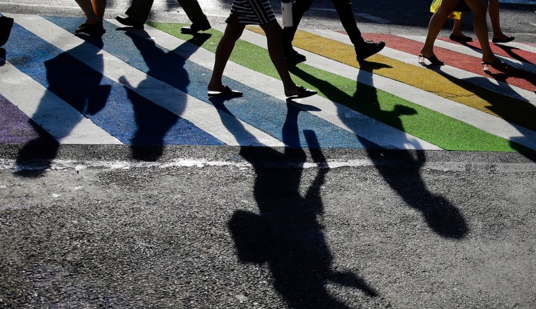 Pedestrians cross the intersection of Christopher Street and Seventh Avenue near the Stonewall Inn on June 27, 2019, in New York. The Human Rights Campaign declared a state of emergency for LGBTQ+ people in the U.S. on Tuesday, June 6, 2023, and a released âa guidebook for actionâ summarizing what it calls discriminatory laws in each state, along with âknow your rightsâ information and health and safety resources.