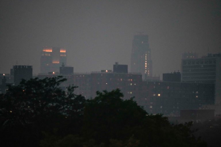 The New York City Skyline is seen through haze from Yankee Stadium during the fifth inning of a baseball game between the New York Yankees and the Chicago White Sox Tuesday, June 6, 2023, in New York. 