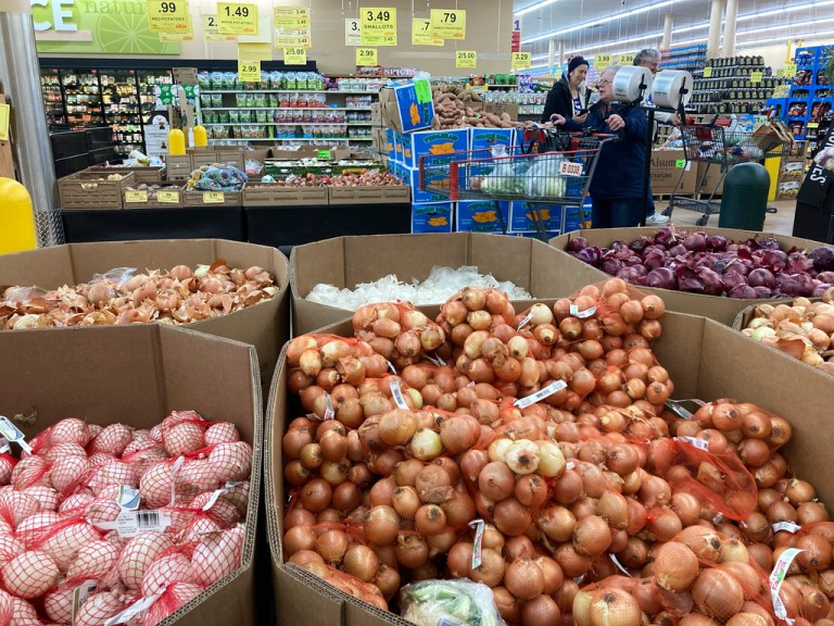 People shop at a grocery store in Buffalo Grove, Ill., Sunday, March 19, 2023. Consumer prices in the United States cooled last month, rising just 0.1% from April to May and extending the past year's steady easing of inflation. 