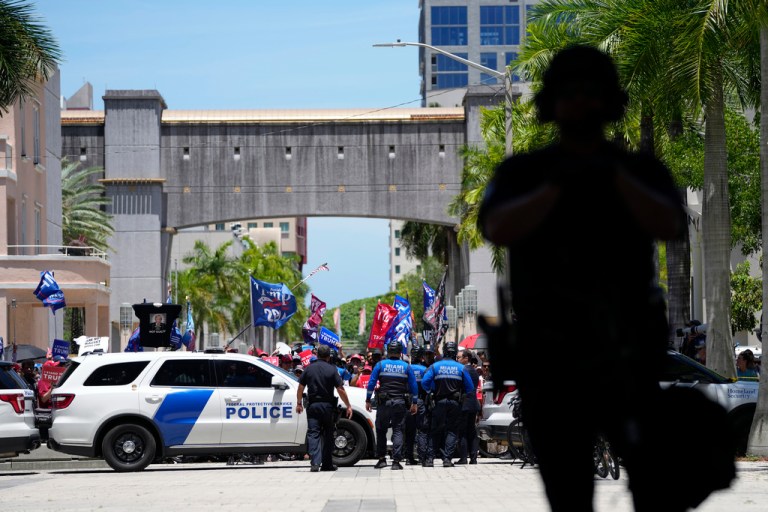 Authorities stand guard outside the Wilkie D. Ferguson Jr. U.S. Courthouse, Tuesday, June 13, 2023, in Miami, after former President Donald Trump arrived at the federal court. Trump is making a federal court appearance on dozens of felony charges accusing him of illegally hoarding classified documents and thwarting the Justice Department's efforts to get the records back. 