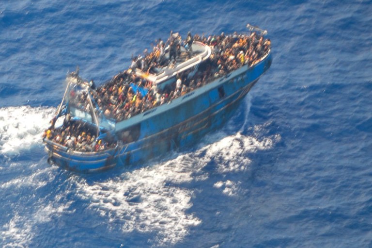 This undated handout image provided by Greece's coast guard on Wednesday, June 14, 2023, shows scores of people on a battered fishing boat that later capsized and sank off southern Greece. A fishing boat carrying migrants trying to reach Europe capsized and sank off Greece on Wednesday, authorities said, leaving at least 79 dead and many more missing in one of the worst disasters of its kind this year.