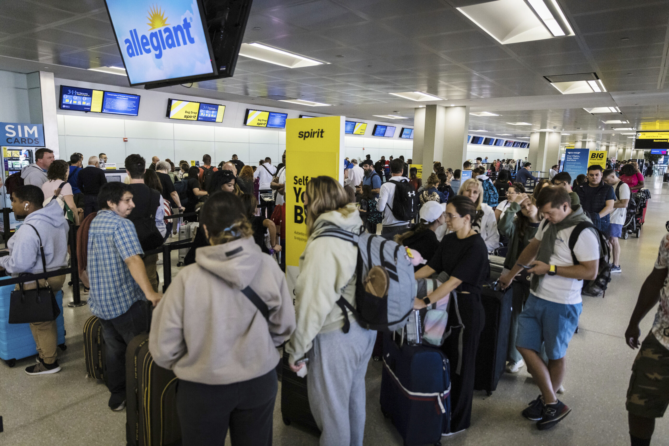 Flight delays and cancellations stack up ahead of holiday weekend travel