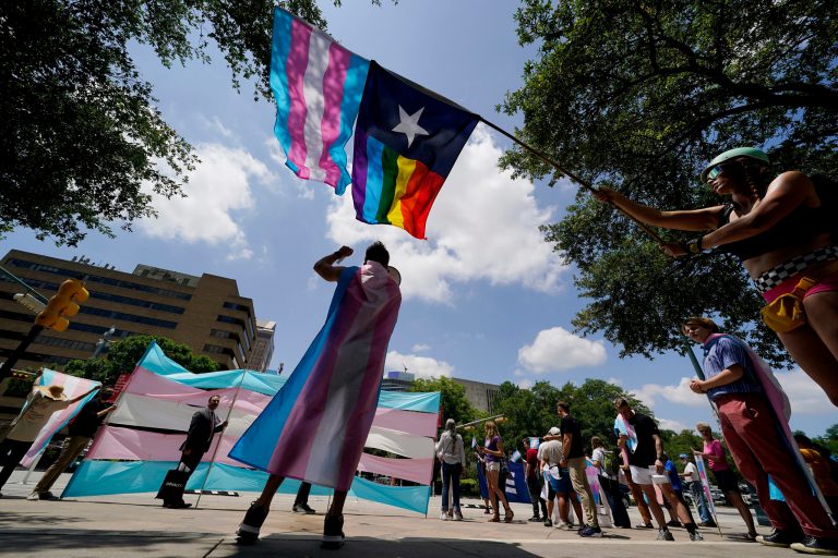FILE - Demonstrators gather on the steps to the State Capitol to speak against transgender-related legislation bills being considered in the Texas Senate and House, May 20, 2021, in Austin, Texas. (AP Photo/Eric Gay, File)
