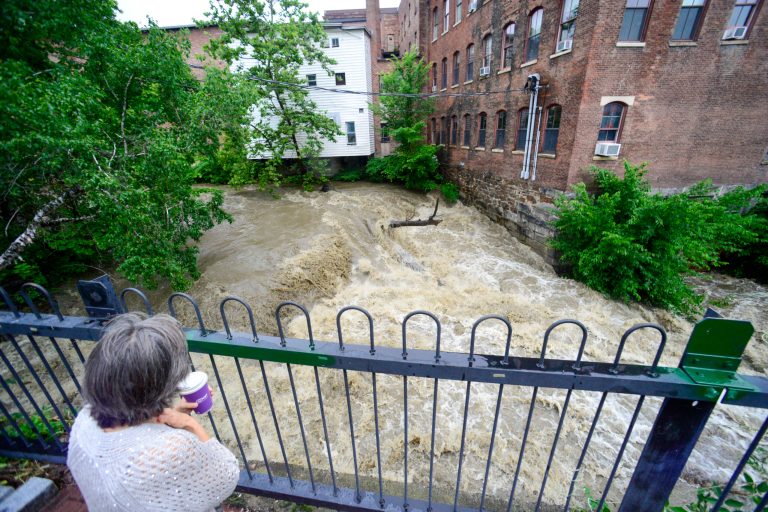 Melissa Morgan, of Northfield, Massachusetts, looks at the water flow at the Whetstone Brook in Brattleboro, Vermont, on Monday, July 10, 2023. 