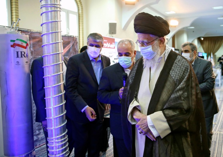 In this photo released by the Office of the Iranian Supreme Leader, Supreme Leader Ayatollah Ali Khamenei (right) visits an exhibition of the country's nuclear achievements in Tehran, Iran, Sunday, June 11, 2023.
