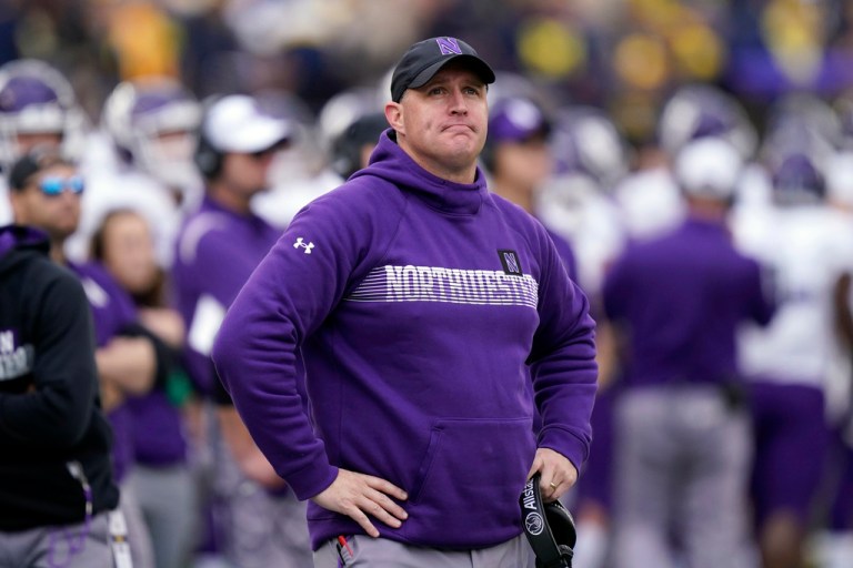FILE - Northwestern head coach Pat Fitzgerald stands on the sideline during the first half of an NCAA college football game against Michigan, Oct. 23, 2021, in Ann Arbor, Mich.