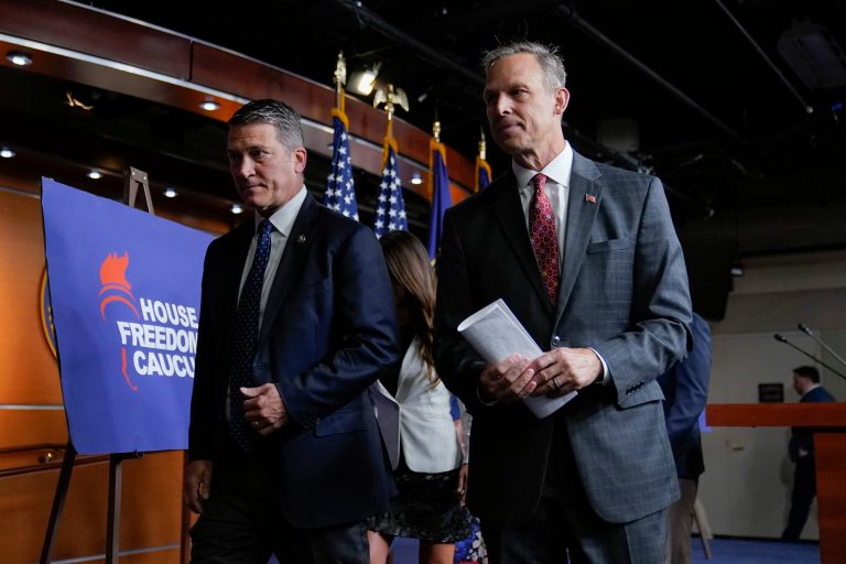 Rep. Scott Perry (R-PA), right, chairman of the House Freedom Caucus, departs a news conference with Rep. Ronny Jackson (R-TX) on Friday, July 14, 2023, on Capitol Hill in Washington. 