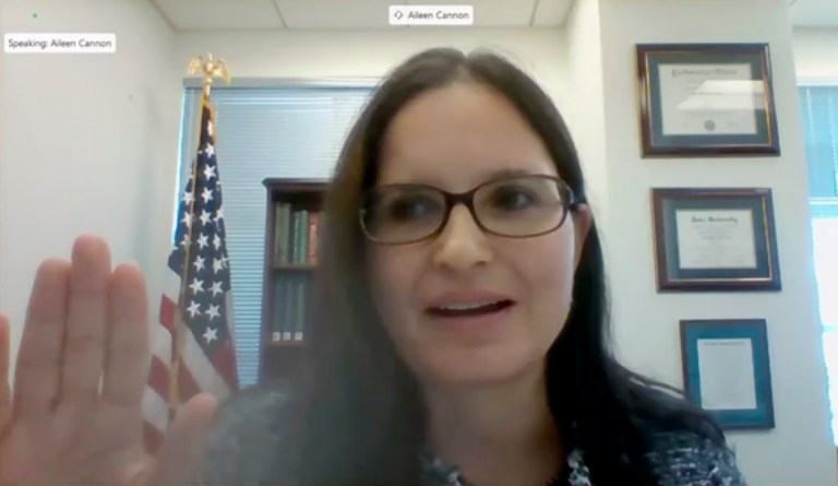 In this image from video provided by the U.S. Senate, Aileen M. Cannon raises her hand after being sworn in to testify remotely during a Senate Judiciary Committee oversight nomination hearing to be U.S. District Court for the Southern District of Florida on July 29, 2020, in Washington. 