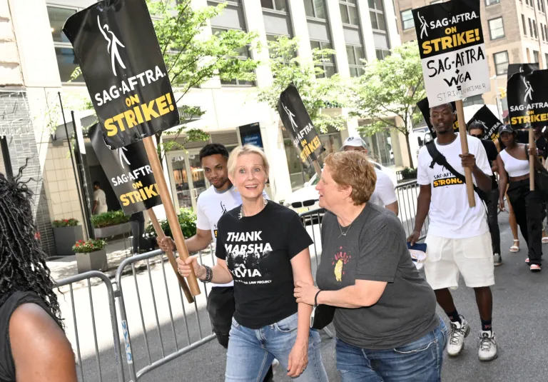 Actor Cynthia Nixon, left, and Christine Marinoni appear on the picket line outside Netflix on Friday, July 21, 2023, in New York. (Photo by Evan Agostini/Invision/AP)