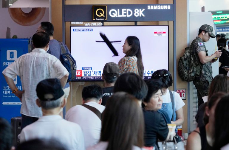 A TV screen shows a file image of North Korea's missile launch during a news program at the Seoul Railway Station in Seoul, South Korea, Saturday, July 22, 2023. (AP Photo/Ahn Young-joon)