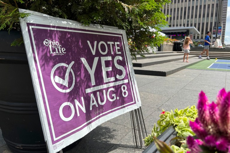 A sign sits in Fountain Square asking Ohioans to vote in support of Issue 1 during an event hosted by Created Equal on Thursday, July 20, 2023, in Cincinnati, Ohio. 