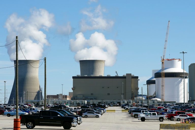 Reactors for Unit 3 and 4 sit at Georgia Power's Plant Vogtle nuclear power plant on Jan. 20, 2023, in Waynesboro, Georgia, with the cooling towers of older Units 1 and 2 billowing steam in the background. Company officials announced Monday, July 31, 2023, that Unit 3 has reached commercial operation after years of delays and billions in cost overruns.
