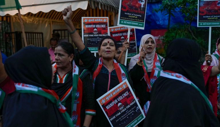 Activists of India's opposition Congress party protesting against ethnic violence in northeastern Manipur state hold placards in Mumbai, India, Monday, July 31, 2023. More than 130 people have been killed in the northeastern state since violence between two dominant ethnic groups erupted in early May.