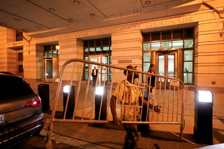 Workers put up barricades outside the E. Barrett Prettyman U.S. Federal Courthouse, Wednesday, Aug. 2, 2023, in Washington. Former President Donald Trump is due in court on Thursday, the first step in a legal process that will play out in a courthouse between the White House he once controlled and the Capitol his supporters once stormed.