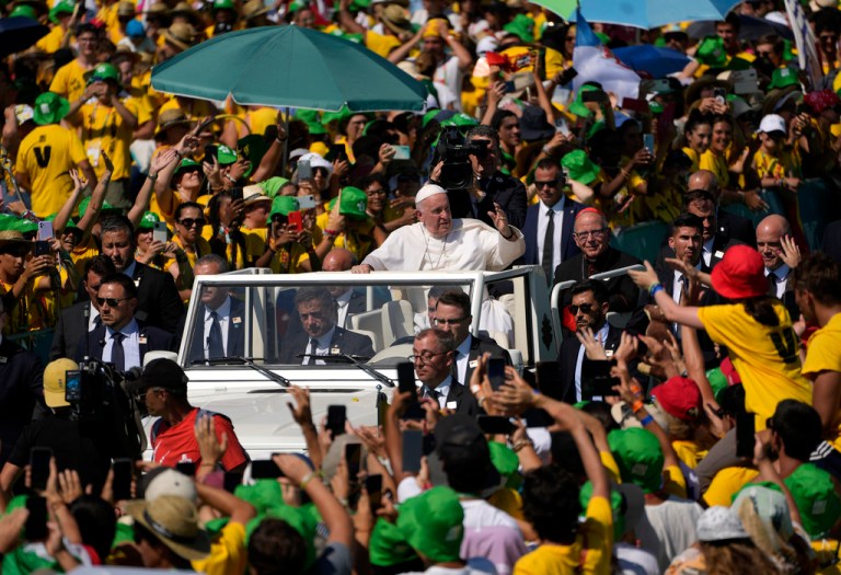 Pope Francis arrives to meet thousands of World Youth Day volunteers at Passeio Maritimo in Alges, just outside Lisbon, Sunday, Aug. 6, 2023. 