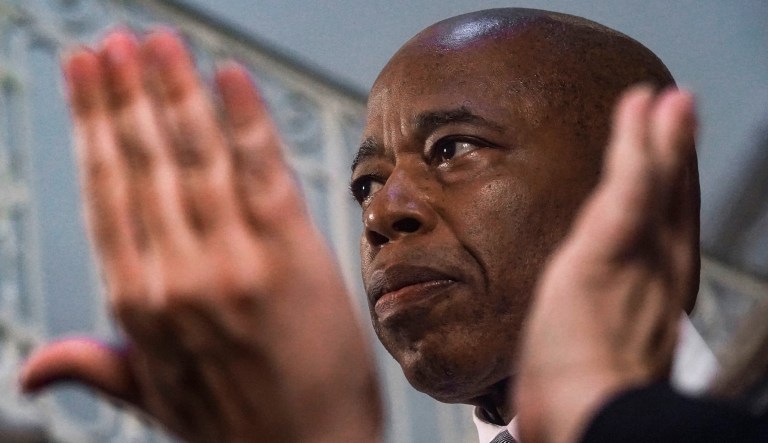 New York Mayor Eric Adams listens while a sign language interpreter translates reporters questions during a City Hall press conference on Wednesday, Aug. 9, 2023, in New York. Adams is calling on the federal government to declare a national emergency to ease the financial crisis the city is facing as it struggles to accommodate thousands of arriving immigrants.