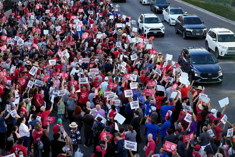 Members of the Culinary Workers Union rally along the Strip on Aug. 10, 2023, in Las Vegas. The union rallied to support servers, dishwashers, cooks, and bartenders who work at T-Mobile Arena and have been locked in contract negotiations for nearly a year with their employer, Levy Premium Food Service. 