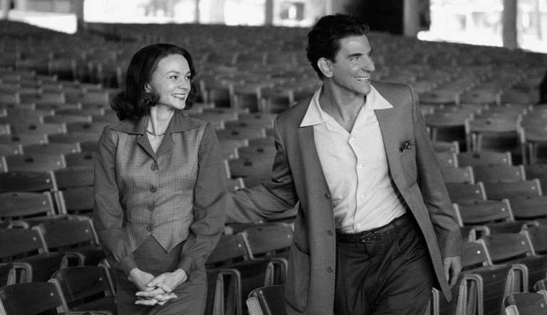 This image released by Netflix shows Carey Mulligan as Felicia Montealegre, left, and Bradley Cooper as Leonard Bernstein in a scene from 