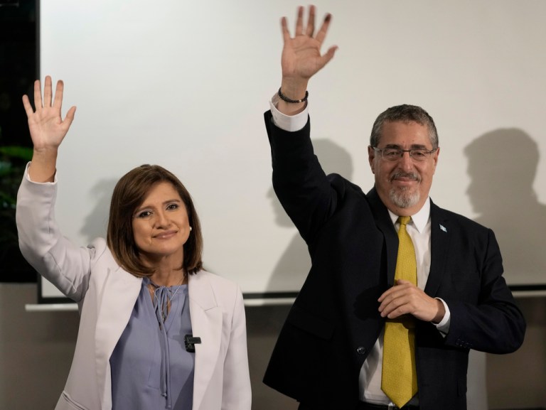 Presidential candidate Bernardo Arevalo and his running mate Karin Herrera wave during a press conference after preliminary results showed them as the victors in a presidential run-off election in Guatemala City, Sunday, Aug. 20, 2023.