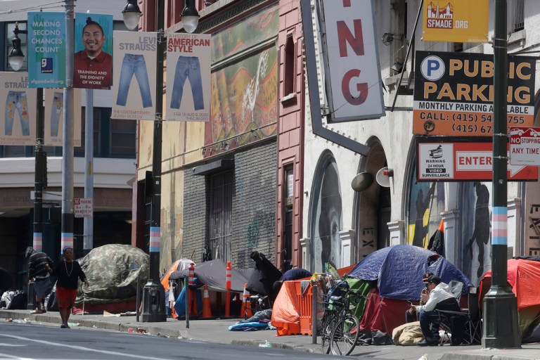 FILE - Tents line a sidewalk in San Francisco, on April 18, 2020.