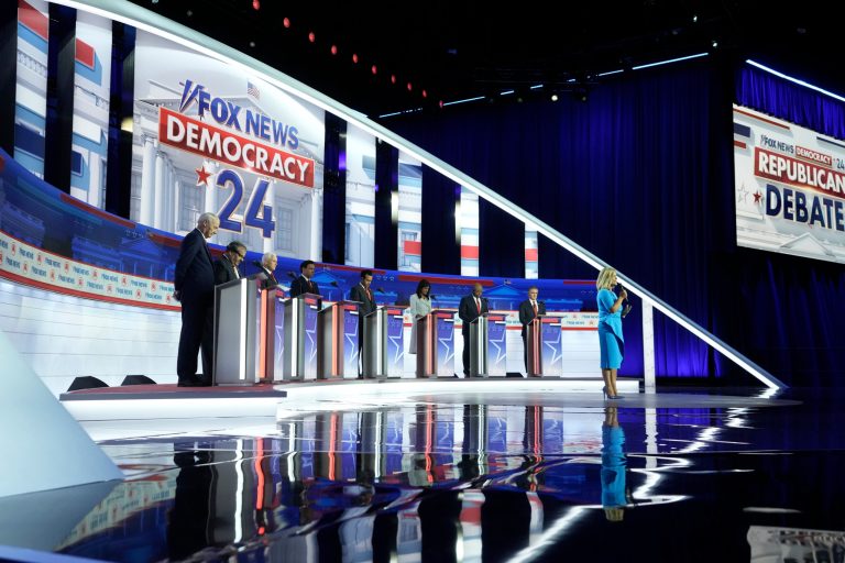 Republican presidential candidates, from left, former Arkansas Gov. Asa Hutchinson, former New Jersey Gov. Chris Christie, former Vice President Mike Pence, Florida Gov. Ron DeSantis, businessman Vivek Ramaswamy, former U.N. Ambassador Nikki Haley, Sen. Tim Scott, R-S.C., and North Dakota Gov. Doug Burgum stand on stage before a Republican presidential primary debate hosted by FOX News Channel Wednesday, Aug. 23, 2023, in Milwaukee. 