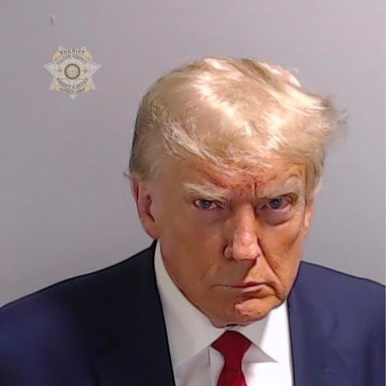 This booking photo provided by Fulton County Sheriff's Office shows former President Donald Trump after he surrendered and was booked at the Fulton County Jail in Atlanta. 