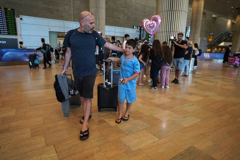 Passengers arriving from the Indian Ocean island nation of Seychelles that made an emergency stop in Saudi Arabia upon landing at Ben Gurion Airport in Lod, near Tel Aviv, Israel, on Tuesday, Aug. 29, 2023. 