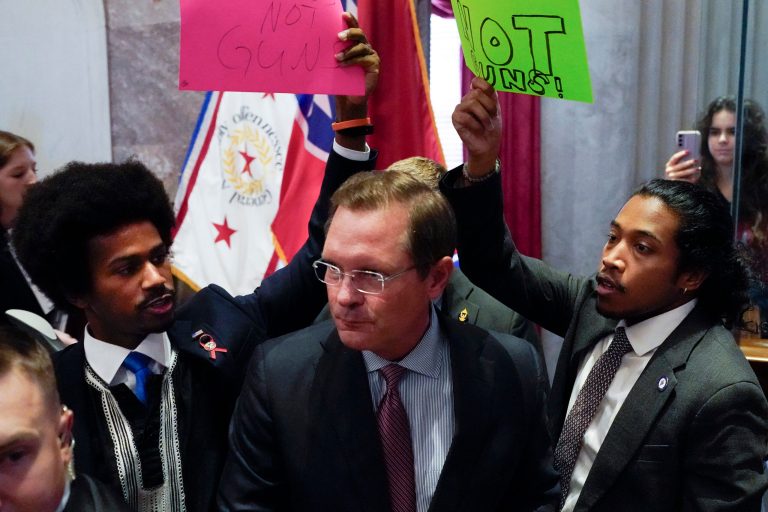 State House Speaker Cameron Sexton, center, pushes past state Rep. Justin Pearson, left, and state Rep. Justin Jones.