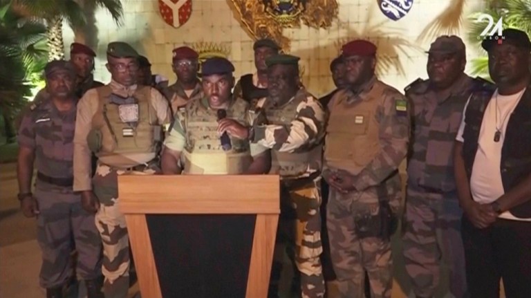 This video grab shoes the spokesperson for the mutinous soldiers speaking on state television as they announce that they had seized power in Libreville, Wednesday Aug. 30, 2023. 