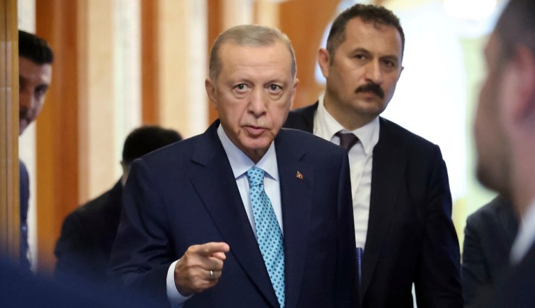 Turkish President Recep Tayyip Erdogan leaves a hall after his talks with Russian President Vladimir Putin at Russia's Black Sea resort of Sochi, Russia, Monday, Sept. 4, 2023.