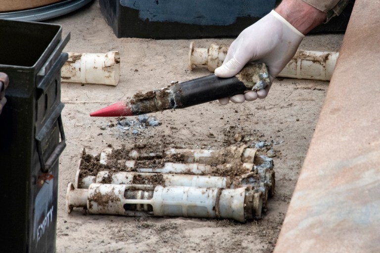 U.S. Air Force National Guard Explosive Ordnance Disposal Techinicians prepare several contaminated and compromised depleted uranium rounds on June 23, 2022 at Tooele Army Depot, Utah. (Staff Sgt. Nicholas Perez/U.S. Air National Guard via AP)
