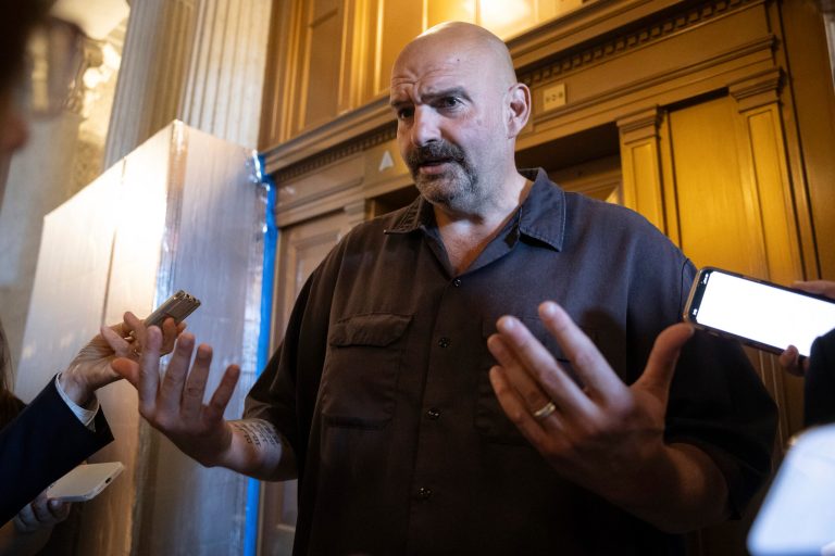 Sen. John Fetterman (D-Pa.) speaks with reporters at the Capitol in Washington on Sept. 7, 2023. 