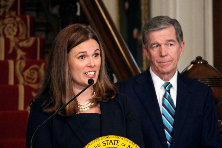 North Carolina Gov. Roy Cooper, right, appoints State Court of Appeals Judge Allison Riggs, left, to the North Carolina Supreme Court.