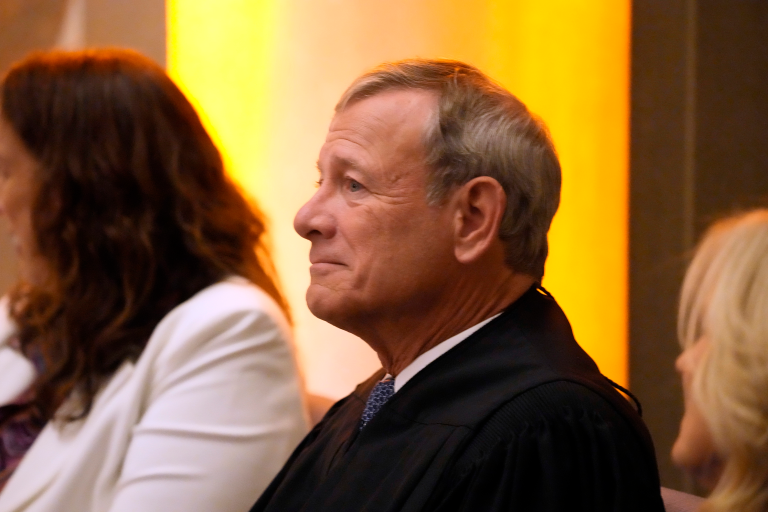 Chief Justice of the United States John Roberts listens as first lady Jill Biden speaks at the National Archivist swearing-in ceremony at the National Archives on Sept. 11, 2023, in Washington. 