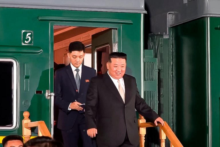 In this Tuesday photo released by the governor of the Russian far eastern region of Primorsky Krai, Oleg Kozhemyako, on his Telegram channel, North Korean leader Kim Jong Un steps down from his train after crossing the border to Russia at Khasan, about 127 km (79 miles) south of Vladivostok.