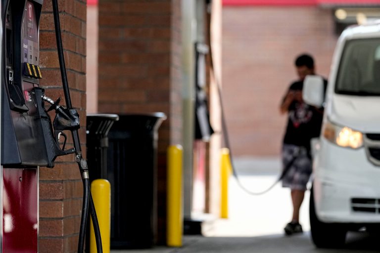 A person pumps gas on Tuesday, Sept. 12, 2023, in Marietta, Georgia.