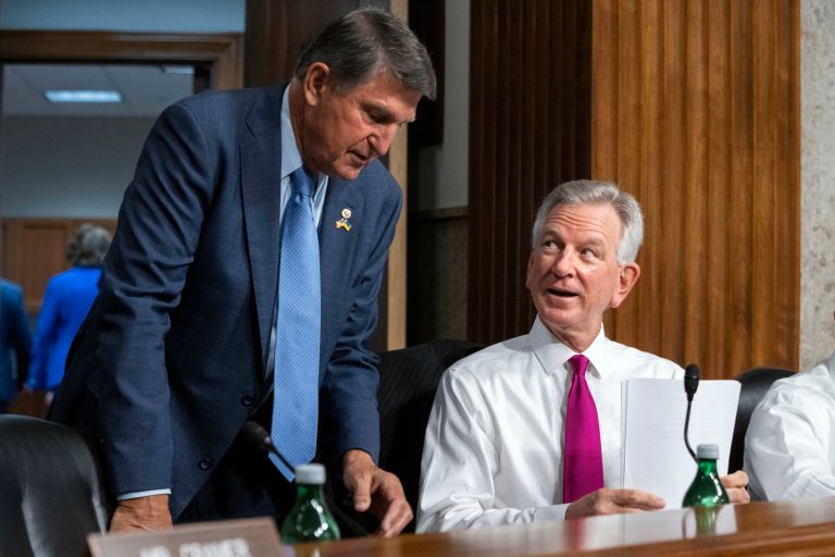 Sen. Joe Manchin (D-WV), left, speaks with Sen. Tommy Tuberville (R-AL) Tuesday, Sept. 12, 2023, on Capitol Hill in Washington. 