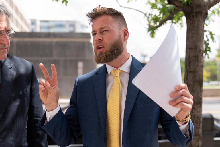 Infowars host Owen Shroyer, accompanied by his attorney Norm Pattis, speaks to reporters outside the E. Barrett Prettyman U.S. Federal Courthouse, Tuesday, Sept. 12, 2023 in Washington.