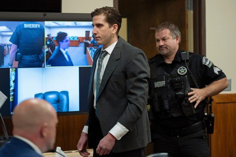 Bryan Kohberger, who is accused of killing four University of Idaho students in November 2022, walks past a video display as he enters a courtroom to appear at a hearing in Latah County District Court, Wednesday, Sept. 13, 2023, in Moscow, Idaho. Kohberger's attorneys wanted cameras banned from the courtroom, contending that news coverage of the criminal proceedings has violated a judge's orders and threatens his right to a fair trial. 
