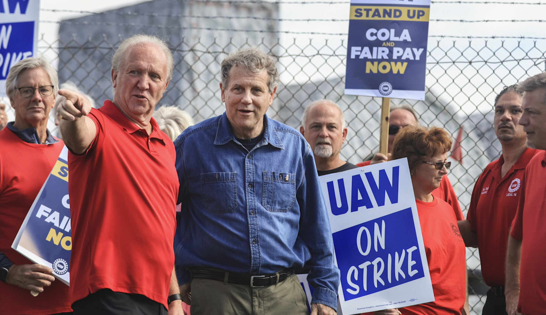 Bruce Baumhower, President at UAW Local 12 talks with US Senator Sherrod Brown on the picket line Friday, Sept. 15, 2023, at the Stellantis Toledo Assembly Complex in Toledo, Ohio. (Jeremy Wadsworth /The Blade via AP)