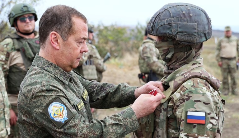 Russian Security Council Deputy Chairman Dmitry Medvedev, front left, awards Russian servicemen during his visit to a military training range for contract servicemen in the Russian-controlled Donetsk region, Ukraine, on Friday, Sept. 15, 2023. 