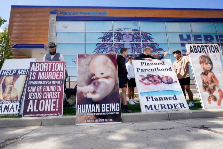Protesters are seen outside Planned Parenthood on Monday, Sept. 18, 2023, in Milwaukee.